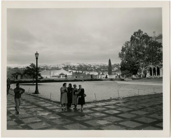 Group of women pose for photo in Royce Hall quad, ca. 1949