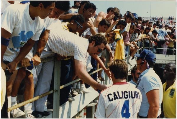 Paul Caligiuri signing autographs for fans at FIFA World Cup All-Star Game, July 1986