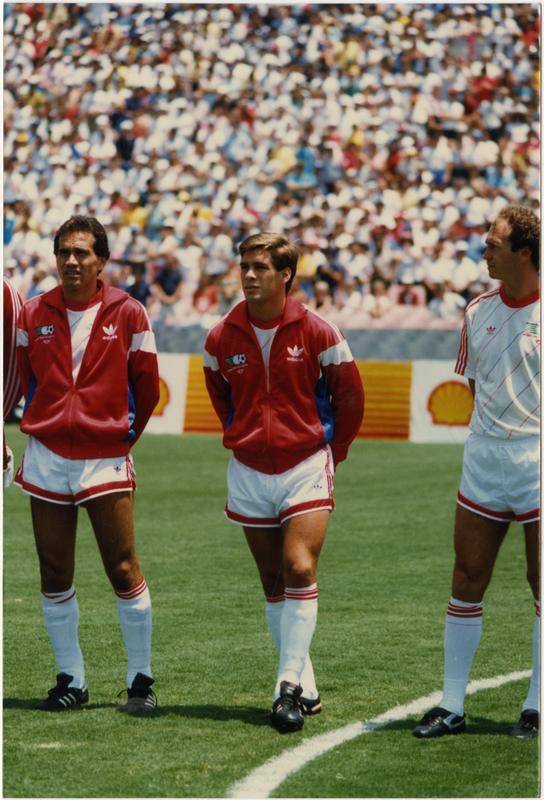 UCLA team member, Paul Caligiuri, standing beside his teammates at 1986 FIFA World Cup All-Star Game , July 1986