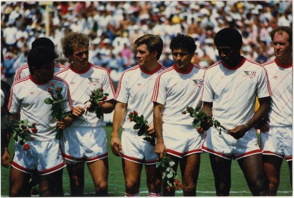 UCLA team member, Paul Caligiuri, standing in center with teammates at 1986 FIFA World Cup All-Star Game , July 1986