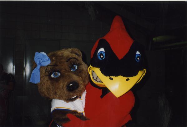 Josie Bruin with Cardinal mascot, ca. April 1997