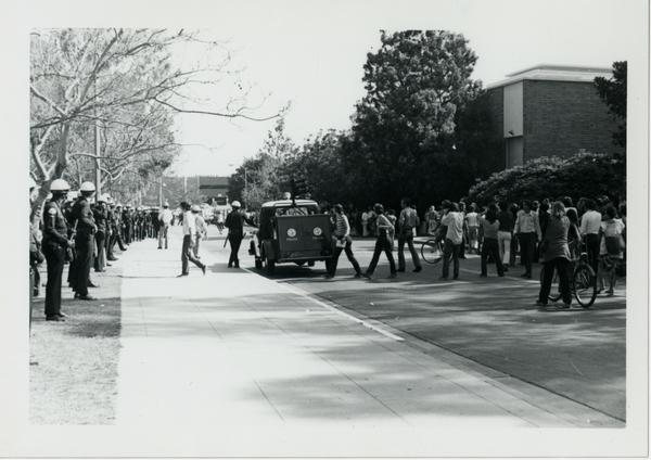 Police and student protestors lined up on street, May 16, 1969