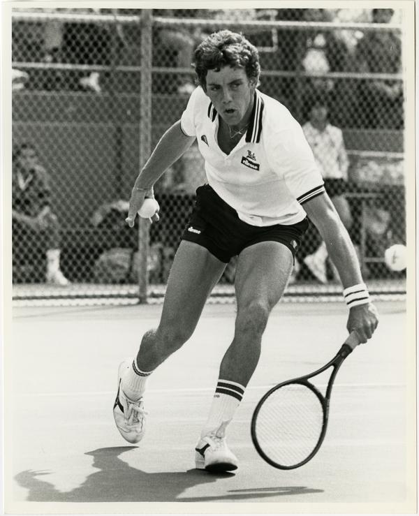 UCLA tennis team member, Robbie Venter, hitting ball with raquet, ca. 1982