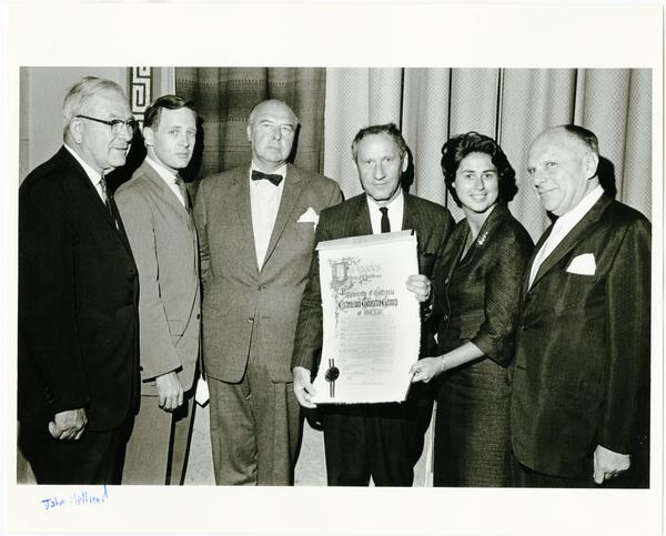 Theater group holding declaration of Extension Theatre Group, ca. 1966