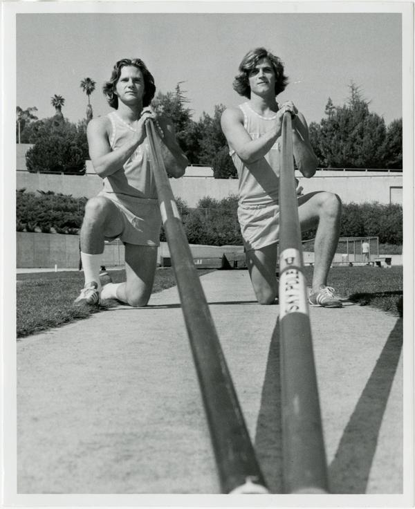 Tim Curran and Mike Tully with poles, ca. 1978