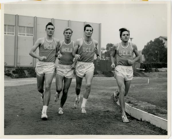 Track team members running