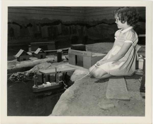 Child playing with boat at Training School