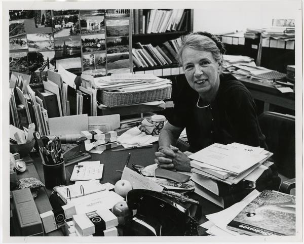 Dr. Mildred Mathias at desk