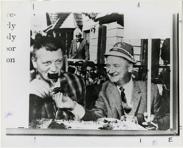 Two men eating