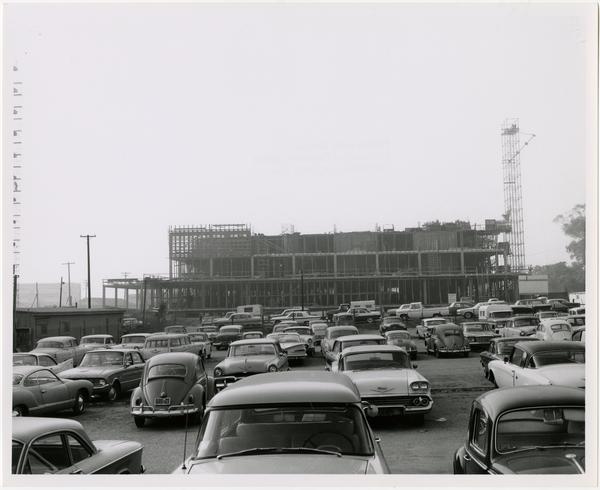 View of parking lot with partially constructed University Research Library in background