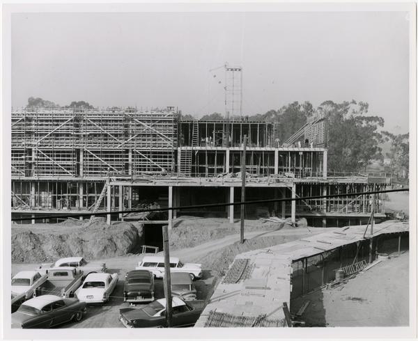 View of partial construction of the University Research Library with parking lot in the foreground