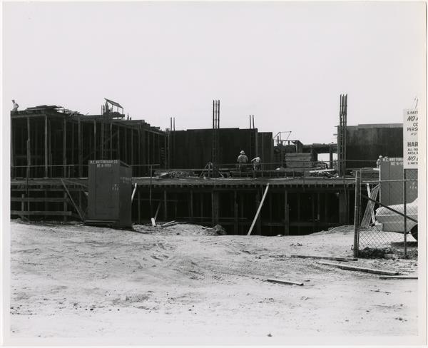 View of partial construction of the University Research Library with workers