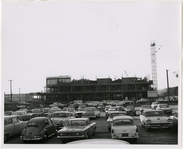 View of parking lot with partially constructed University Research Library in background