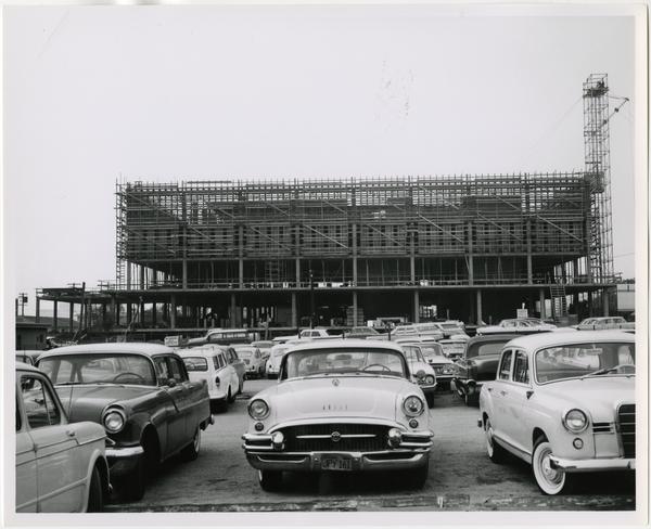 Side view of University Research Library during its construction from parking lot