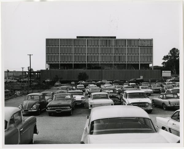 Side view of the construction of the University Research Library from parking lot, December 1963