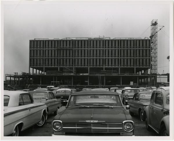 Side view of the construction of the University Research Library from parking lot