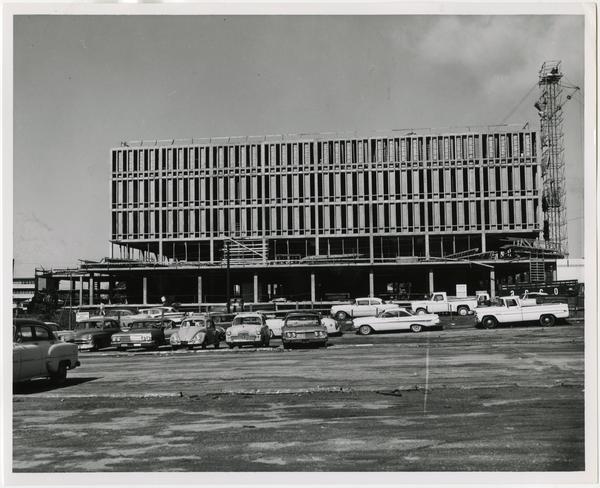 Side view of the University Research Library while in construction from parking lot