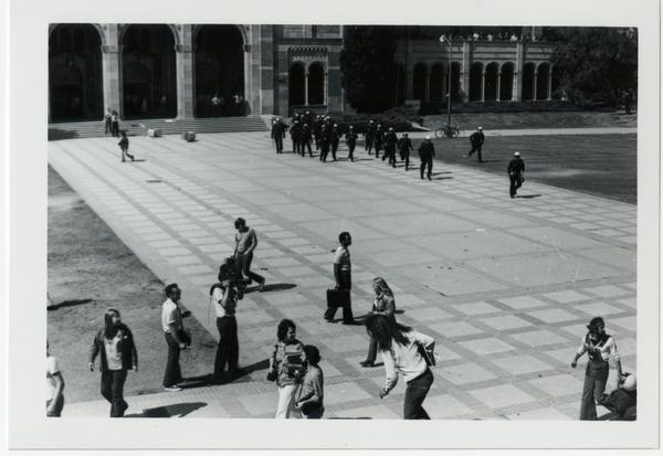 Police marching toward student protesters on Royce Hall quad, May 16, 1969