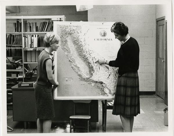 Students looking at California map, ca. 1965