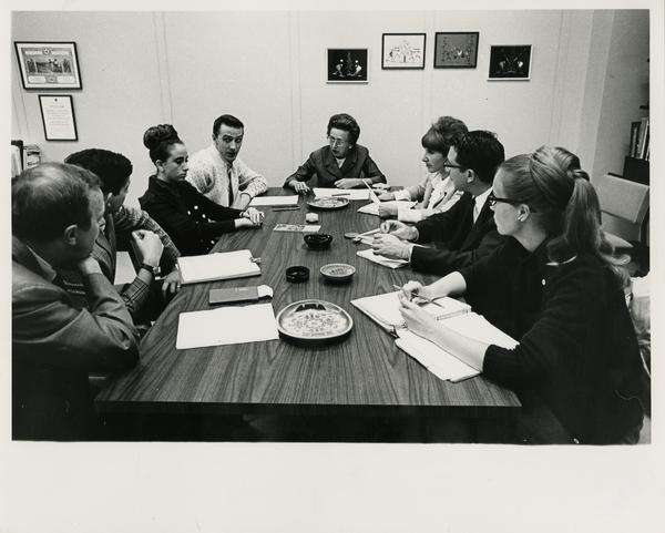 Students sitting around a table, ca. 1965
