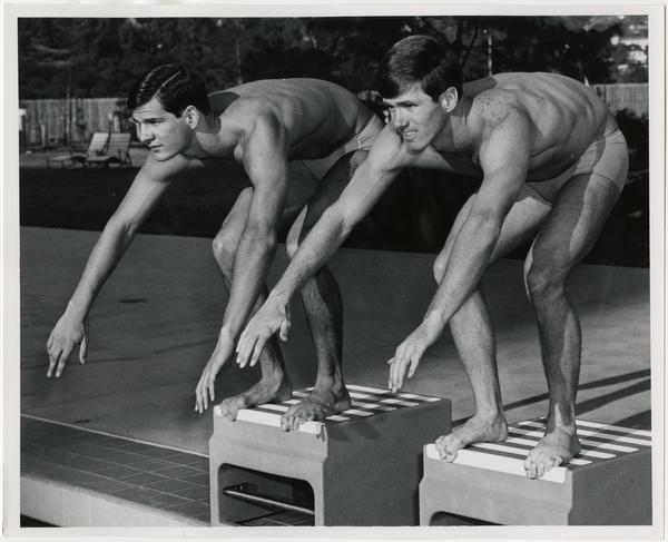 UCLA swim team member, Mike Burton, in starting position on right