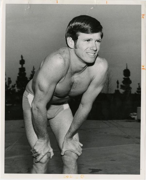 UCLA swim team member, Mike Burton, in starting position