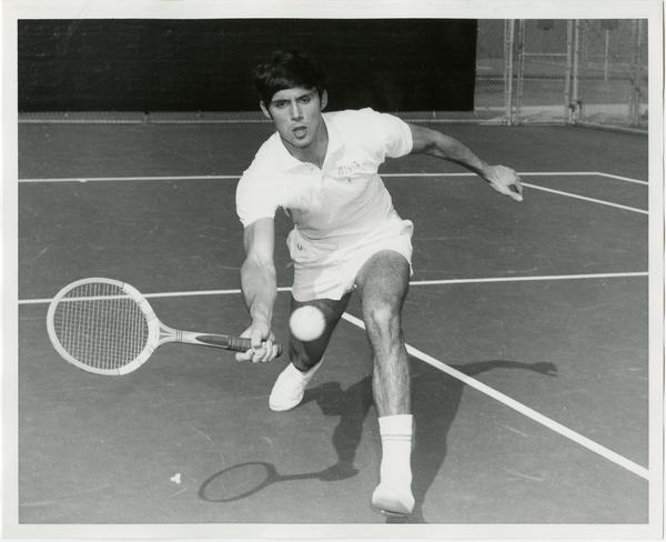 NCAA champion, Jeff Borowiak, hitting ball with raquet, ca. 1970s