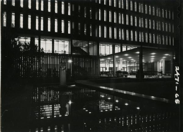 University Research Library with its lights on at night