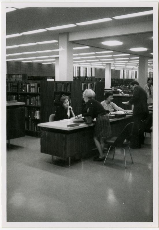 Reference staff member assisting a patron at the University Research Library, ca. 1968