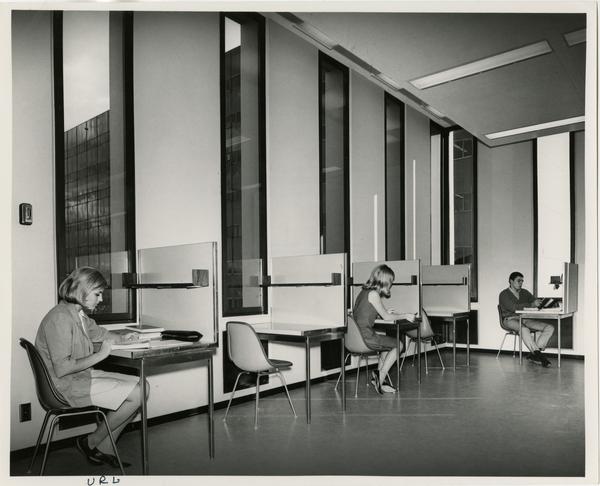 Students studying at desks in the University Research Library, ca. 1964