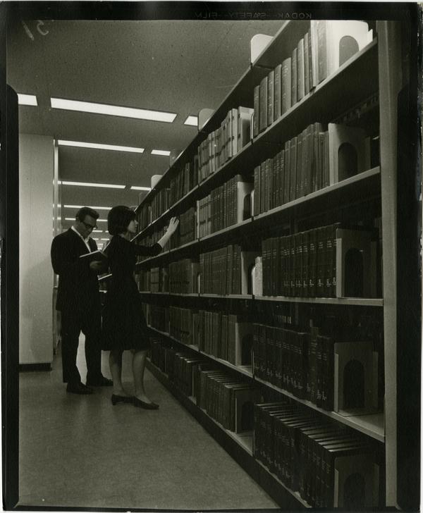 Contact print of library patrons browsing University Research Library stacks, ca. 1964