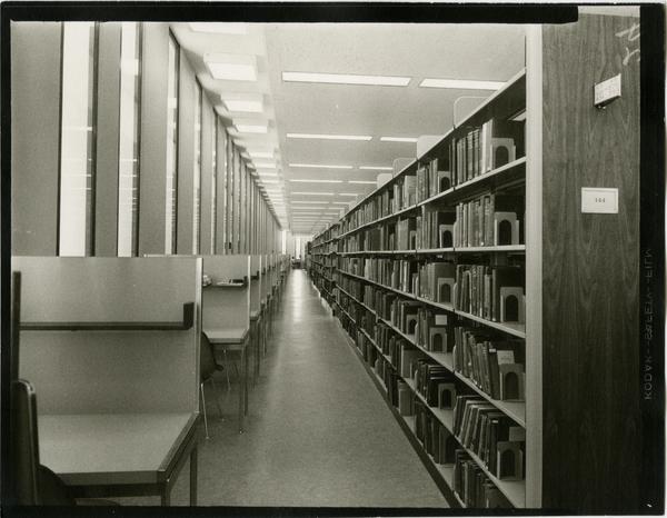 Contact print of stacks alongside study cubicles, ca. 1964