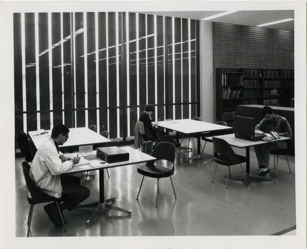 Students studying at tables in University Research Library, ca. 1964