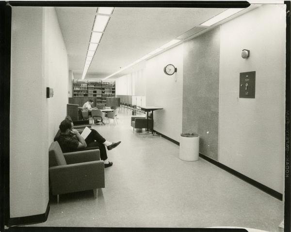 Contact print of students studying in hallway of University Research Library, ca. 1964