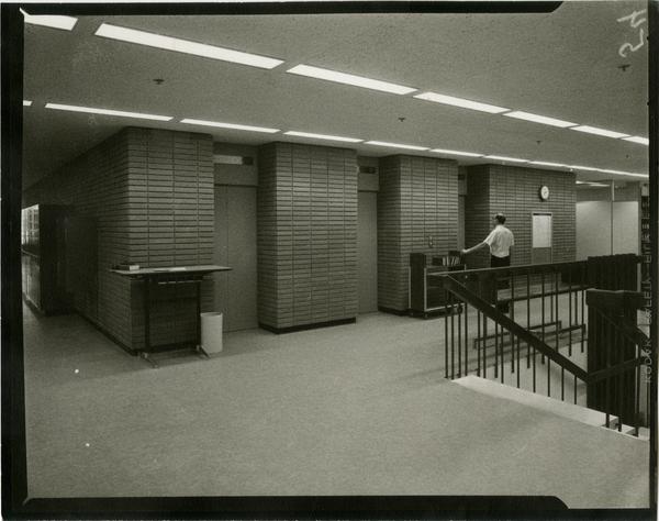 Contact print of second floor elevators in University Research Library, ca. 1964