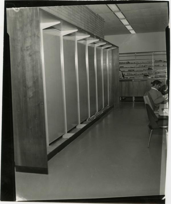 Contact print of patrons working at desk in University Research Library, ca. 1964