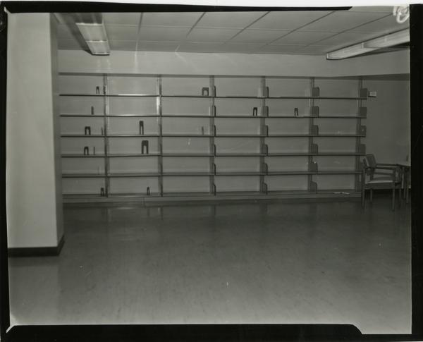 Contact print of empty shelving in University Research Library