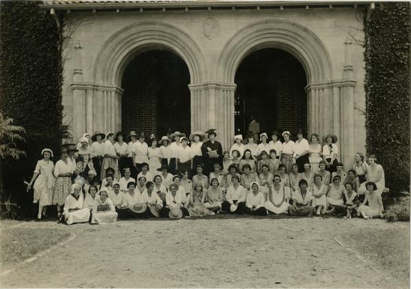 Group portrait of pageant participants in front of building on Vermont Ave campus