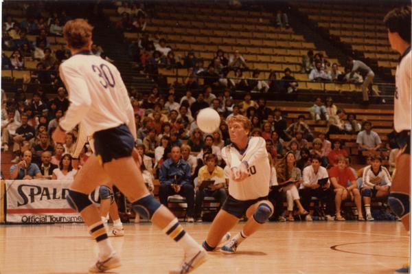 UCLA volleyball player hitting the ball during a game, 1983