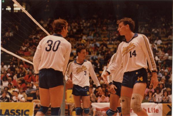UCLA volleyball team speaking to each other during a game, 1983