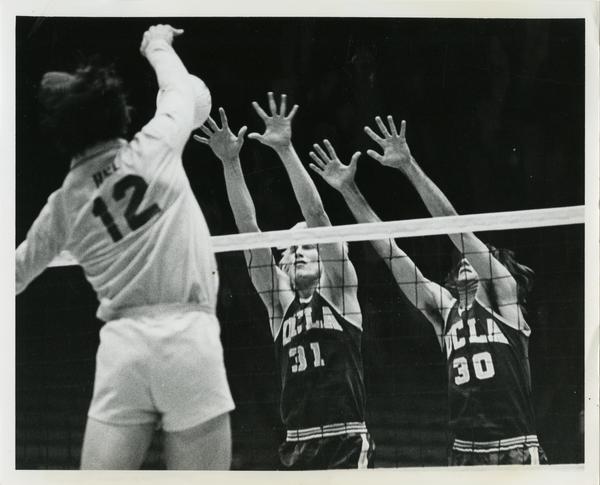 UCLA Volleyball players, Doug Rabe and Fred Sturm blocking against CSULB