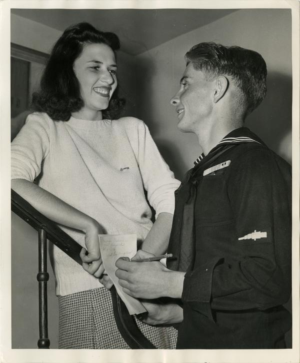 H. R. Tubbs, coxswain, USN, a newly enrolled V-12 student at UCLA, gets the phone number and address of Marjorie Osborne