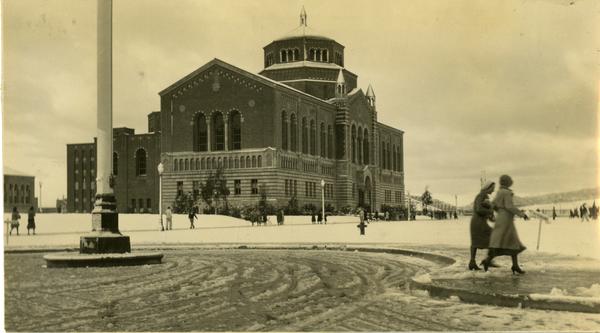 Campus Snow Scene with Co-Eds and Powell Library, 1932