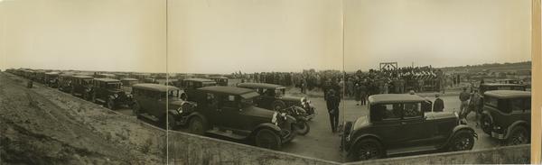 Panoramic view of cars parked along road for UCLA campus groundbreaking, October 1926