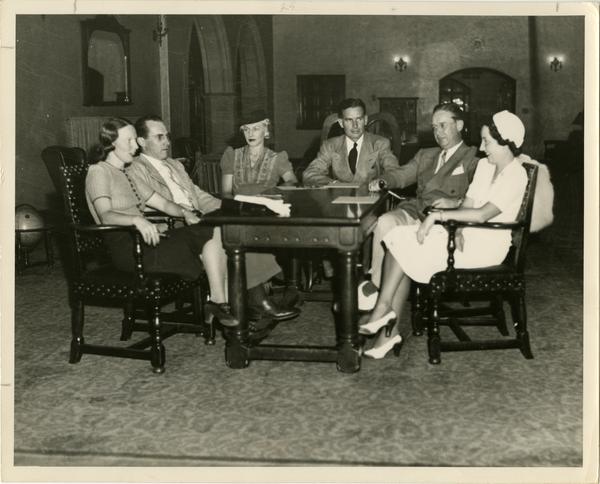 The 1929 Class Officers sit around a table