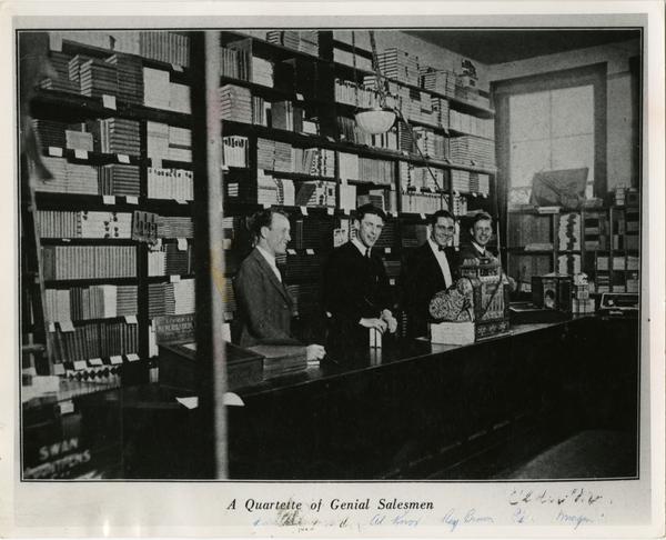Four clerks behind the counter at the Bookstore on the Vermont Campus