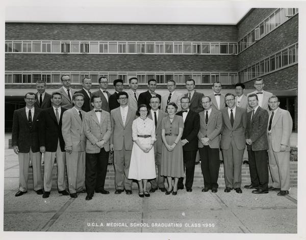 Group photo of the medical school graduating class in front of one of the medical school buildings, 1955