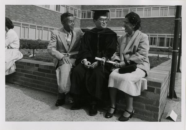 Medical school graduate greets his parents after the ceremony ends, 1956