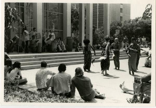 Women of the African Music and Dance Ensemble performing on stage during the Ethno Spring Music Festival, c. 1970's