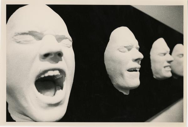 Casts of faces as part of an art exhibit